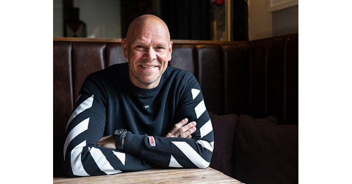 Tom Kerridge is showing families how to cook Christmas dinner for £10